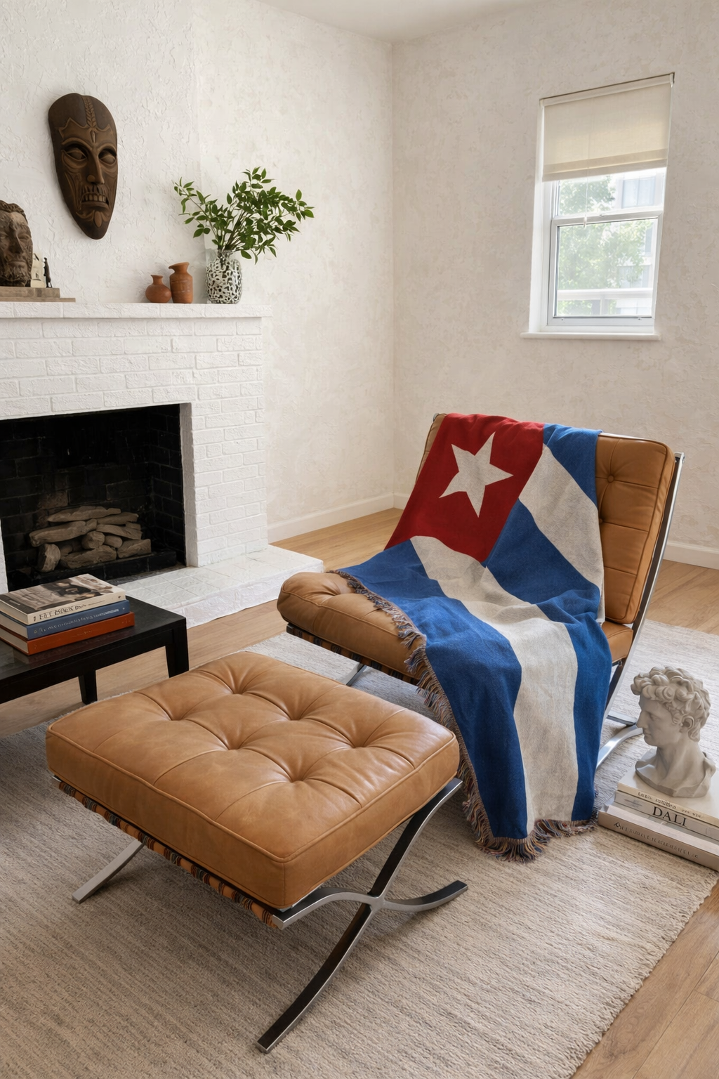 Cuba flag woven throw blanket draped over a leather lounge chair by the fireplace