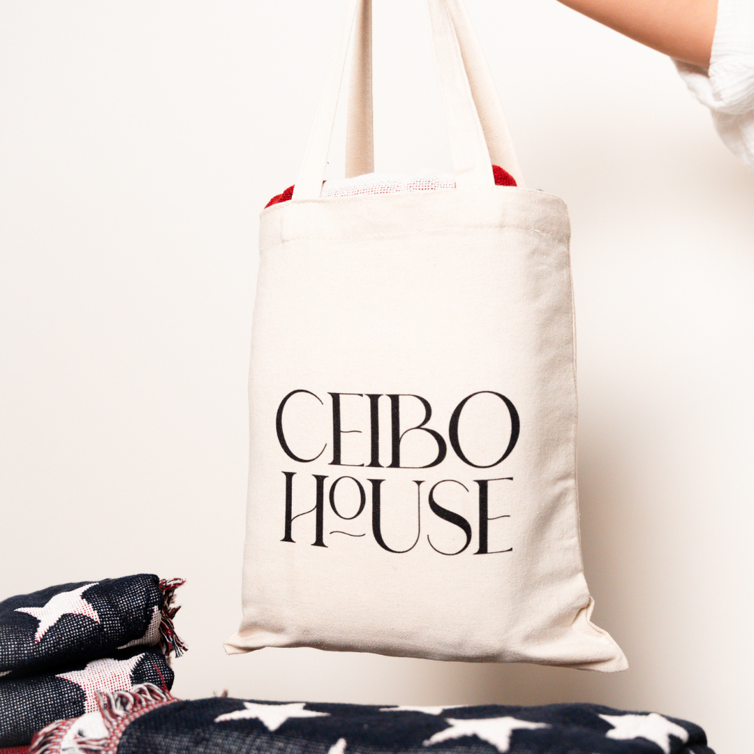 Ceibo House tote bag with the American flag woven throw blanket